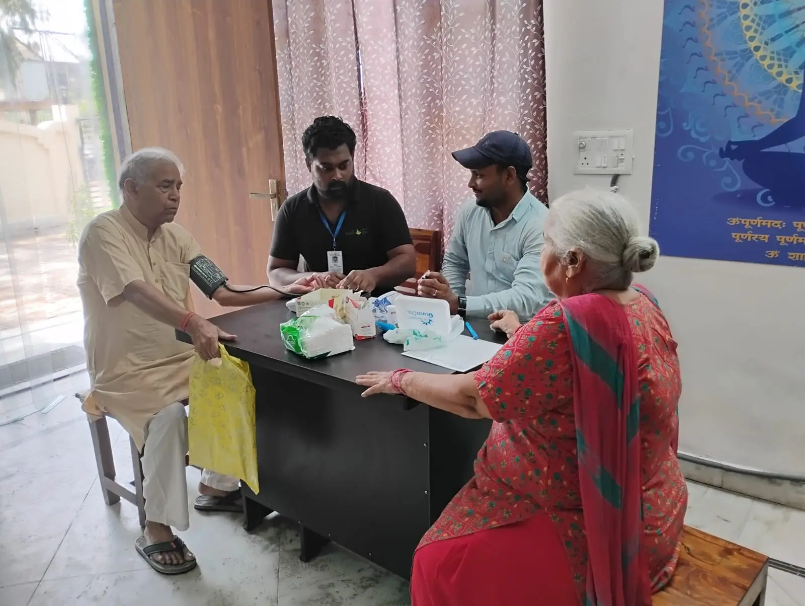 Community members receiving health screening at Purna Ojas